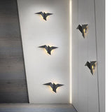 Kreative Wandleuchte aus Eisen in Vogelform